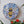 Bee mosaic on the wall surrounded by plants
