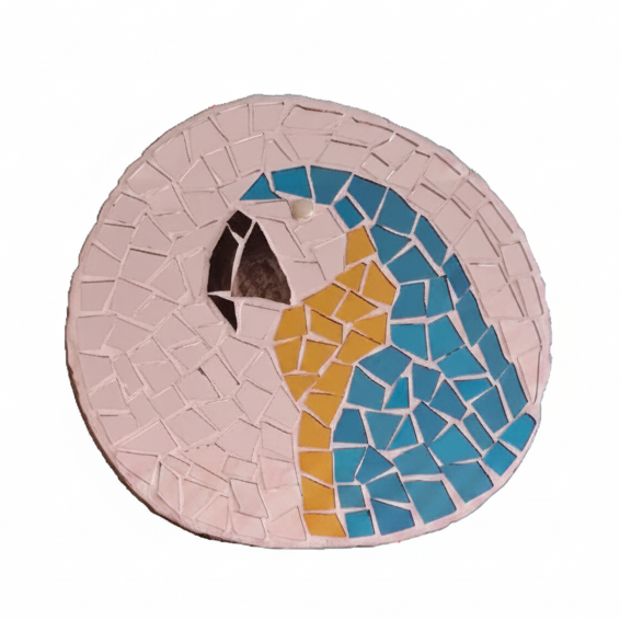 Circular mosaic wall art featuring a stylized macaw design. Crafted with reflective blue and gold mirror glass pieces on a reflective silver mirror background, set on rustic wood.