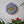Buttercup mosaic on the wall surrounded by plants

