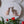 Cat mosaic on the wall surrounded by plants