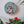 Dog mosaic on the wall surrounded by plants
