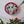 Dog mosaic on the wall surrounded by plants
