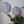 Dog and cat mosaics on the wall surrounded by plants