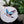 Dove mosaic on the table surrounded by plants