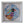 A circular mosaic bird wall art piece mounted inside a square white shadow box frame. The bird is constructed from colorful glass tiles in shades of blue, purple, orange, green, black, and red, set against a white background.