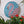 Flamingo mosaic on the wall surrounded by plants
