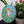 Frog mosaic on the table surrounded by plants