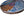 Side view of a circular bird mosaic artwork, showing the rustic wood edge.