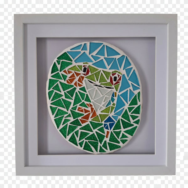 A square white-framed mosaic wall art piece featuring a stylized green frog made of colorful triangular glass-like segments on a light gray background.