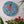Bird mosaic on the wall surrounded by plants
