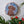 Dog mosaic on the wall surrounded by plants
