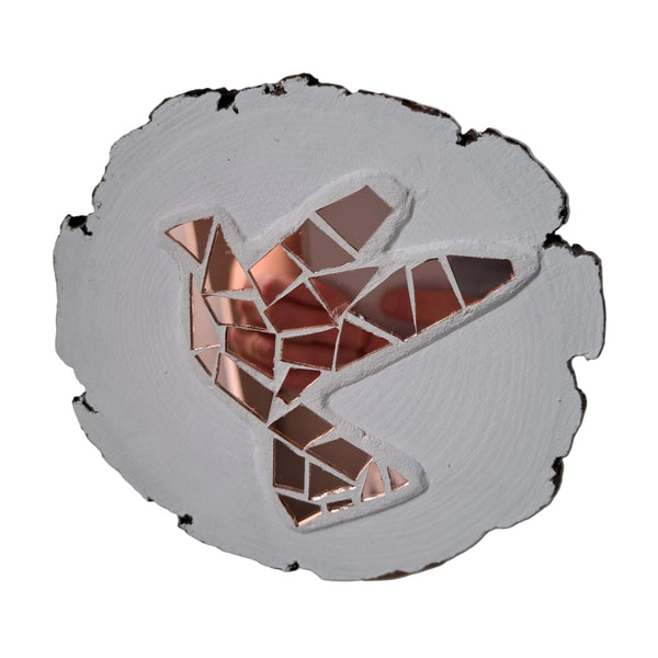 Circular mosaic wall art featuring a stylized dove design. Crafted with reflective rose gold mirror glass pieces on a striking white background, set on rustic wood.