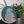 Parrot mosaic on the table surrounded by plants 