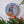 Pheasant mosaic on the wall surrounded by plants
