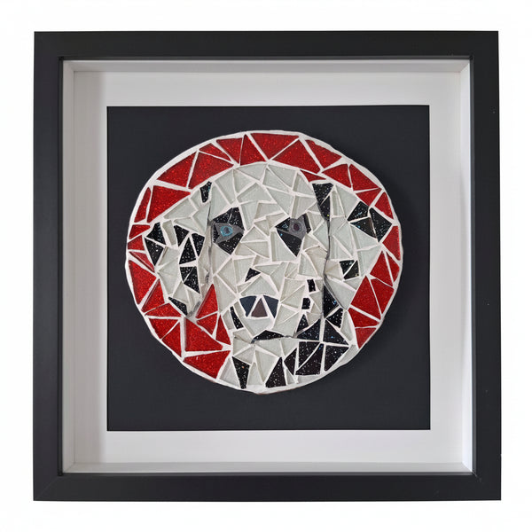 Framed mosaic wall art featuring a stylized dog face made of red, white, and black geometric pieces, mounted on a black square background with a white mat and black frame.