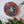 Dog mosaic on the wall surrounded by plants
