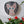 Cat mosaic on the wall surrounded by plants
