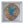 A circular mosaic bird wall art piece displayed inside a white square shadow box frame. The mosaic features a stylized bird constructed from blue, green, purple, and light blue tiles, set against a background of bronze and white geometric pieces.