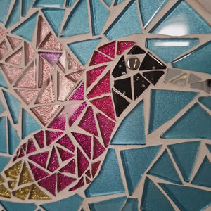 video showing close up of mosaic bird  to catch the changing colours and sparkles
