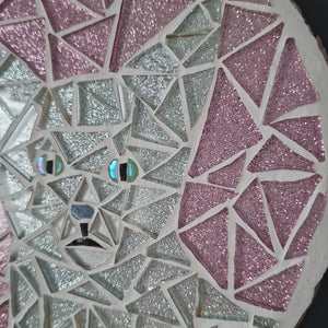 video showing close up of mosaic silver cat face to catch the changing colours and sparkles