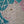 video showing close up of mosaic white cat face to catch the changing colours and sparkles