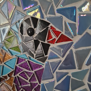 video showing close up of mosaic bird to catch the changing colours and sparkles
