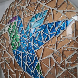 video showing close up of mosaic bird  to catch the changing colours and sparkles