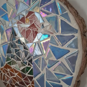 video showing close up of mosaic bird to catch the changing colours and sparkles
